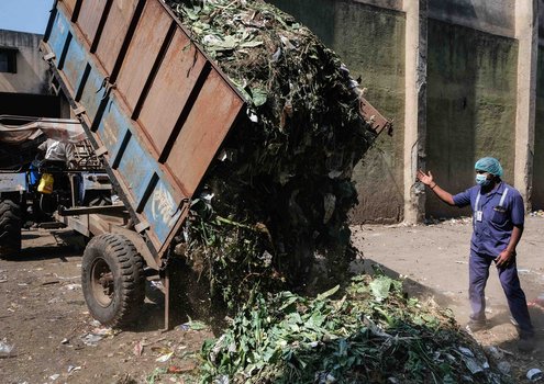 A lorryload of organic waste from close by the city arrives at the waste treatment plant in Nashik.